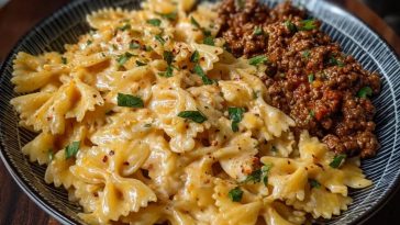 Cheesy Bowtie Pasta with Savory Cajun Ground Beef in Garlic Cream