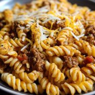 Cheesy Garlic Twisted Pasta with Cajun Ground Beef and Alfredo Velveeta