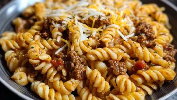 Cheesy Garlic Twisted Pasta with Cajun Ground Beef and Alfredo Velveeta