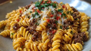 Creamy Mozzarella Rotini with Spicy Cajun Beef and Velveeta Sauce