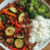 Spicy Ground Beef Stir-Fry Bowl with Garlic Veggies & Steamy Rice